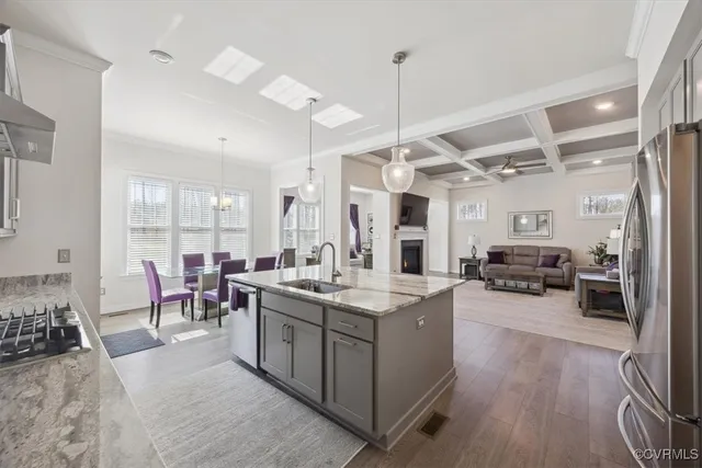 a large kitchen with a table and chairs