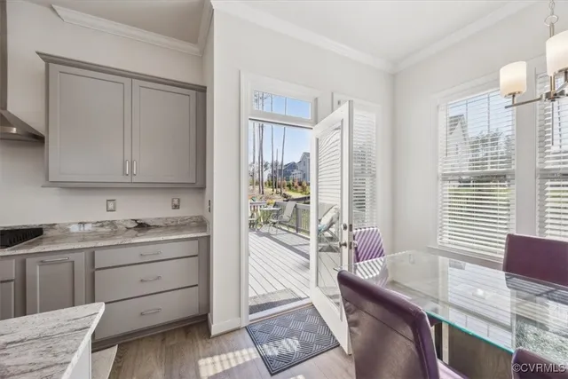 a view of deck with furniture and trees