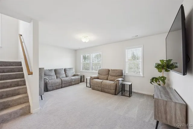 a bathroom with double vanity sinks a large mirror and shower