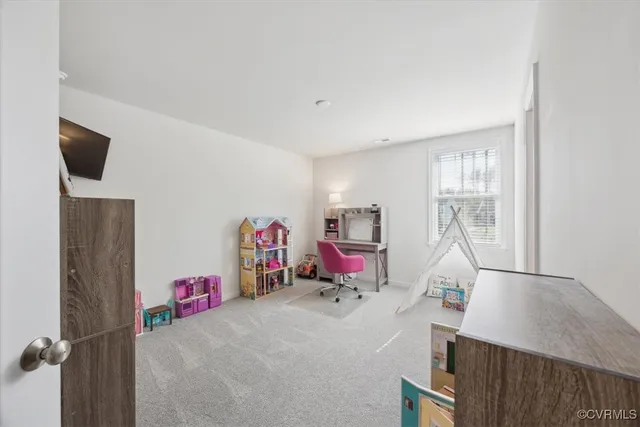 a view of workspace with furniture and window