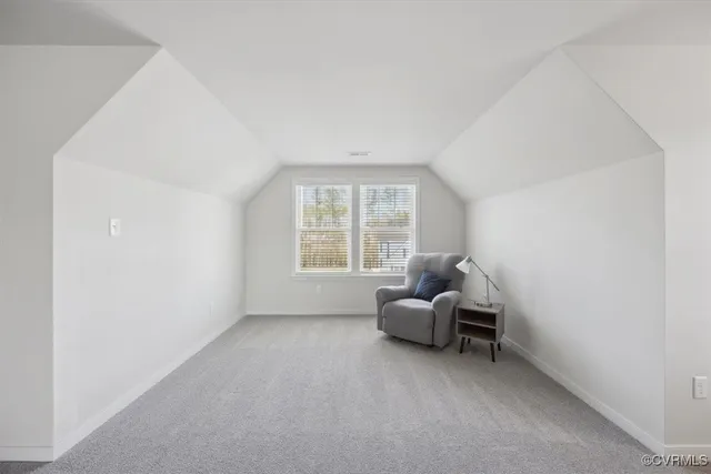 a view of walk in closet with clothes