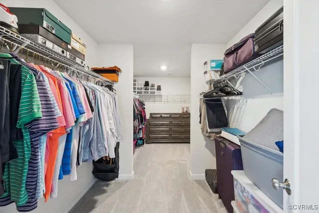 a bathroom with a toilet sink vanity and mirror