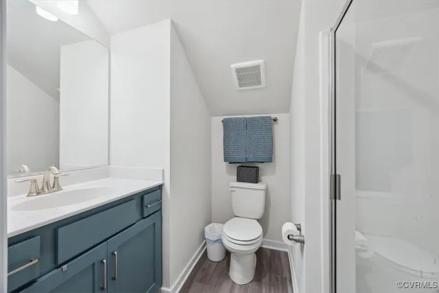 a view of a park with iron fence