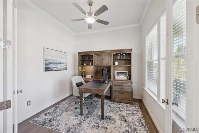 a workspace with wooden floor and a window