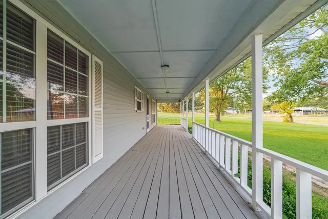 a view of porch with wooden floor and outdoor space