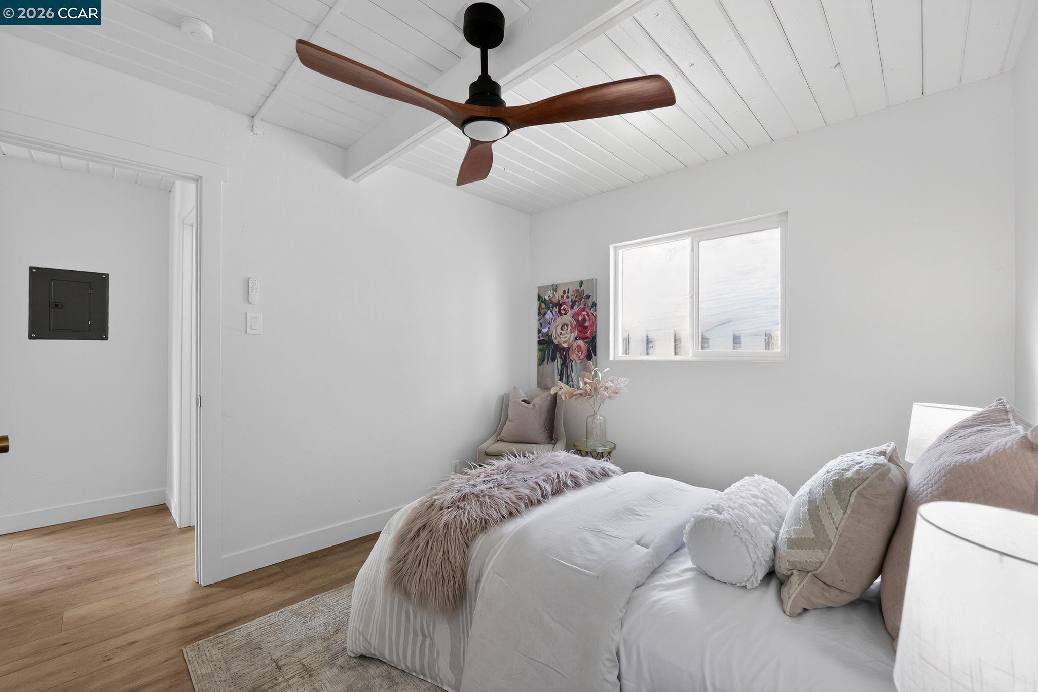 87 Bay Drive Bay Point, CA 94565 - Photo 12 of 22 a bedroom with a bed and a ceiling fan