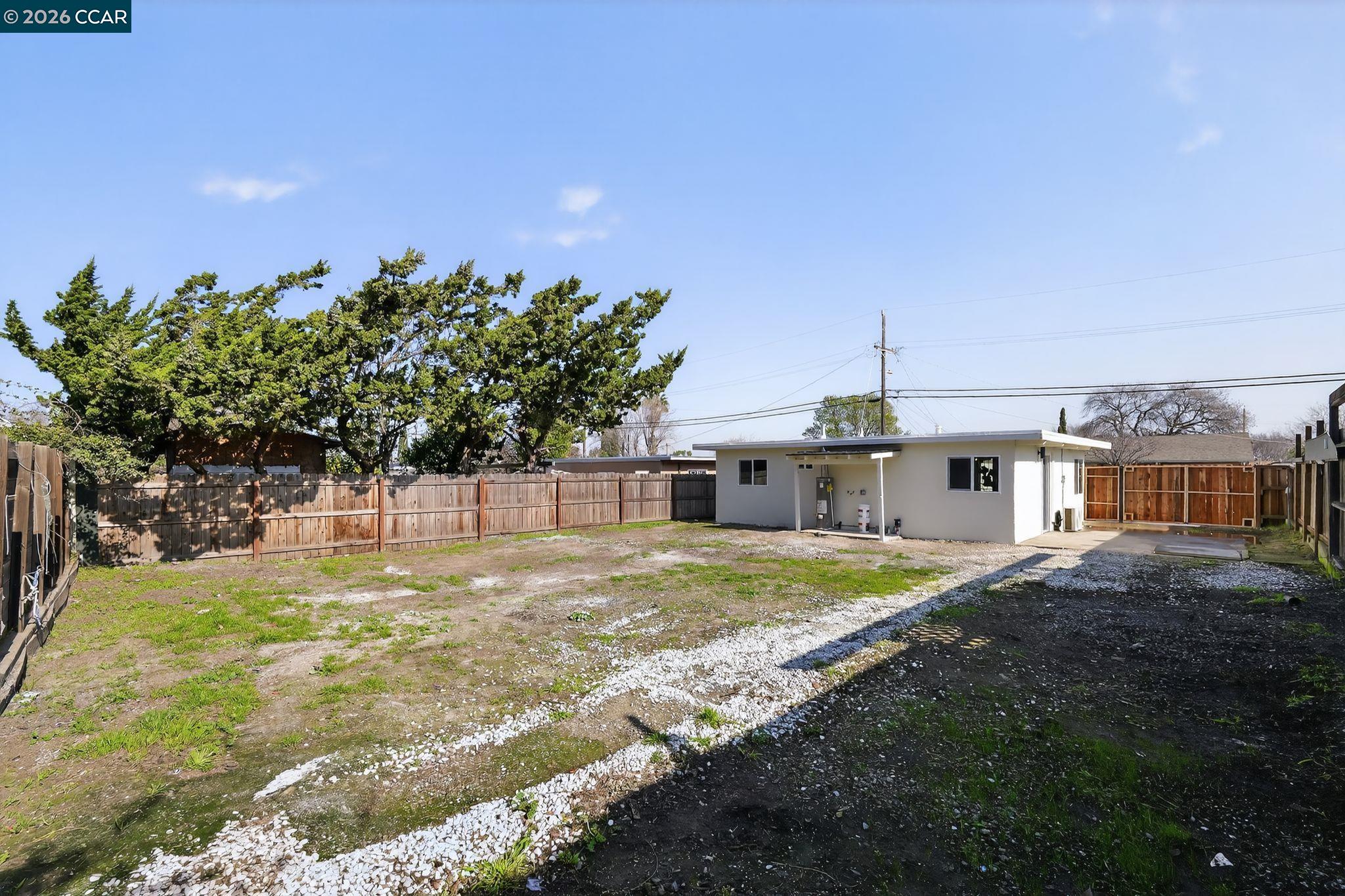 87 Bay Drive Bay Point, CA 94565 - Photo 22 of 22 a backyard of a house with table and chairs