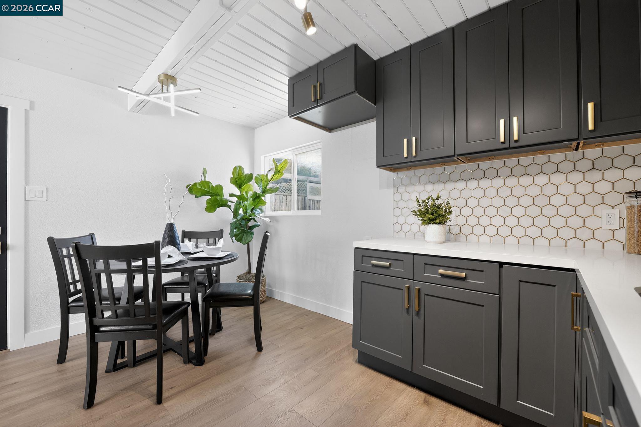 87 Bay Drive Bay Point, CA 94565 - Photo 4 of 22 a view of a kitchen and dining area with furniture