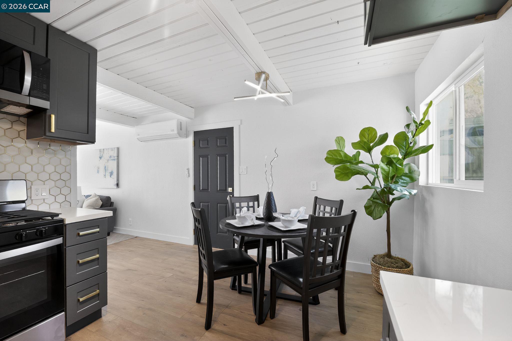 87 Bay Drive Bay Point, CA 94565 - Photo 5 of 22 a dining room with furniture and potted plants