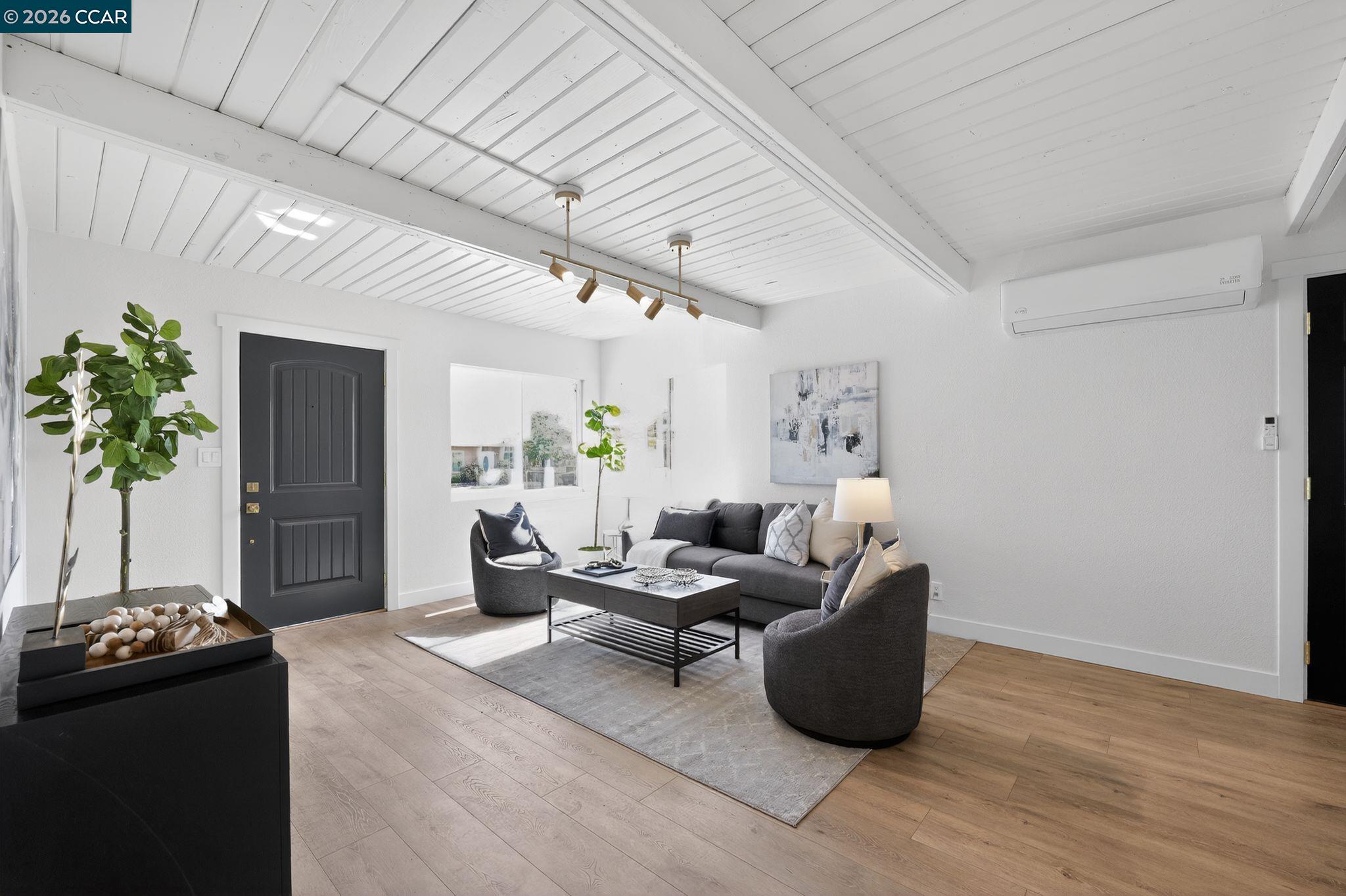 87 Bay Drive Bay Point, CA 94565 - Photo 7 of 22 a living room with furniture and a potted plant