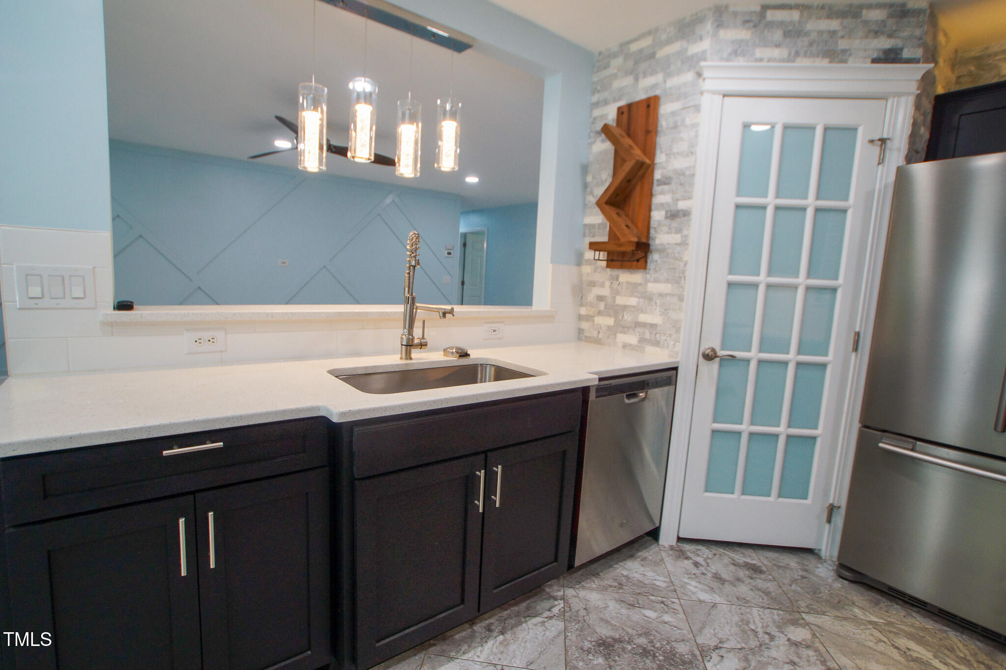 5705 Katha Drive Holly Springs, NC 27540 - Photo 13 of 27 a bathroom with a sink and a mirror