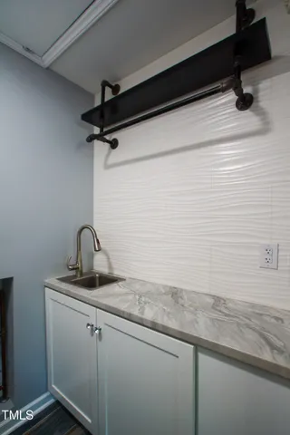 a bathroom with a granite countertop sink