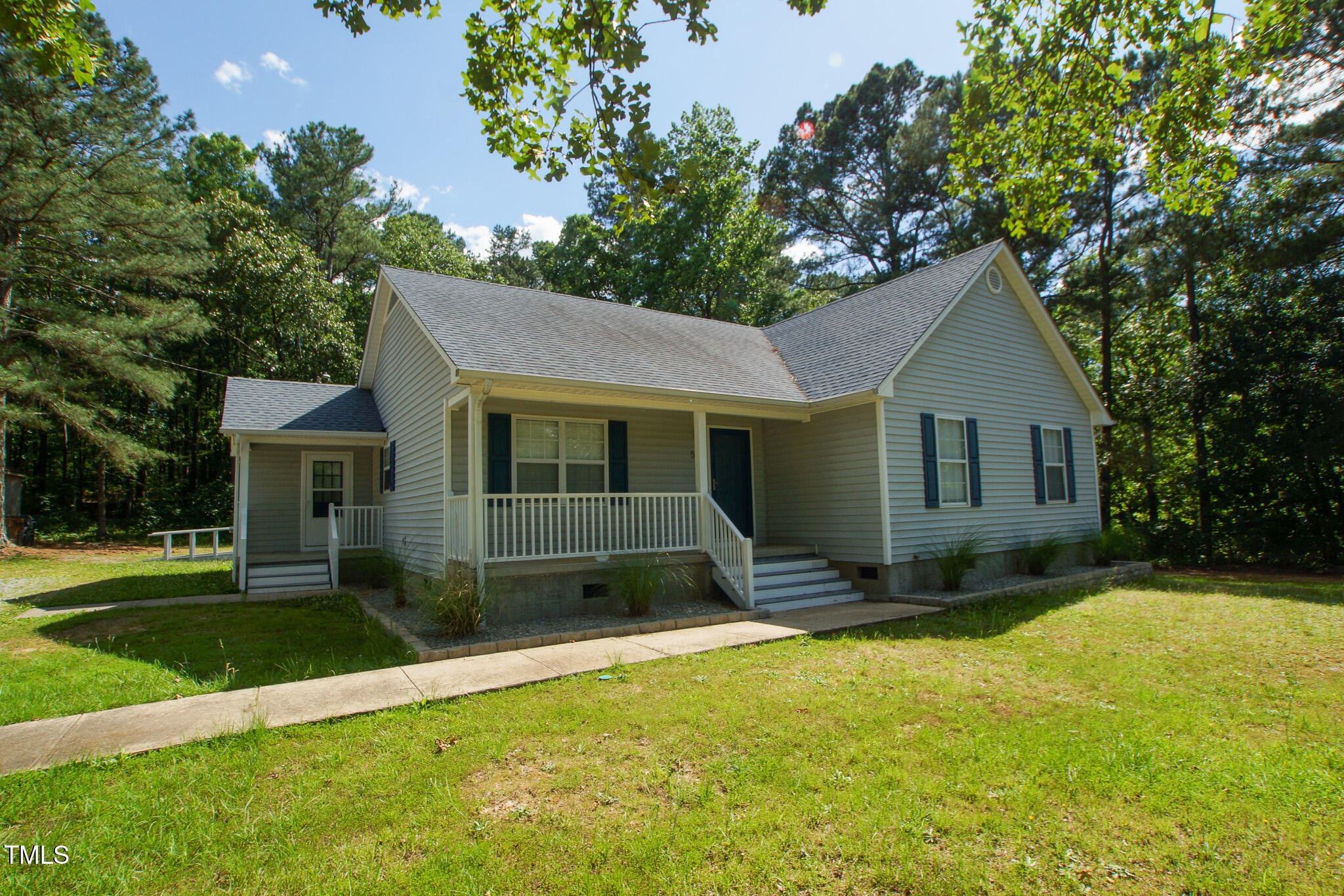 5705 Katha Drive Holly Springs, NC 27540 - Photo 2 of 27 a view of a house with a yard and tree s