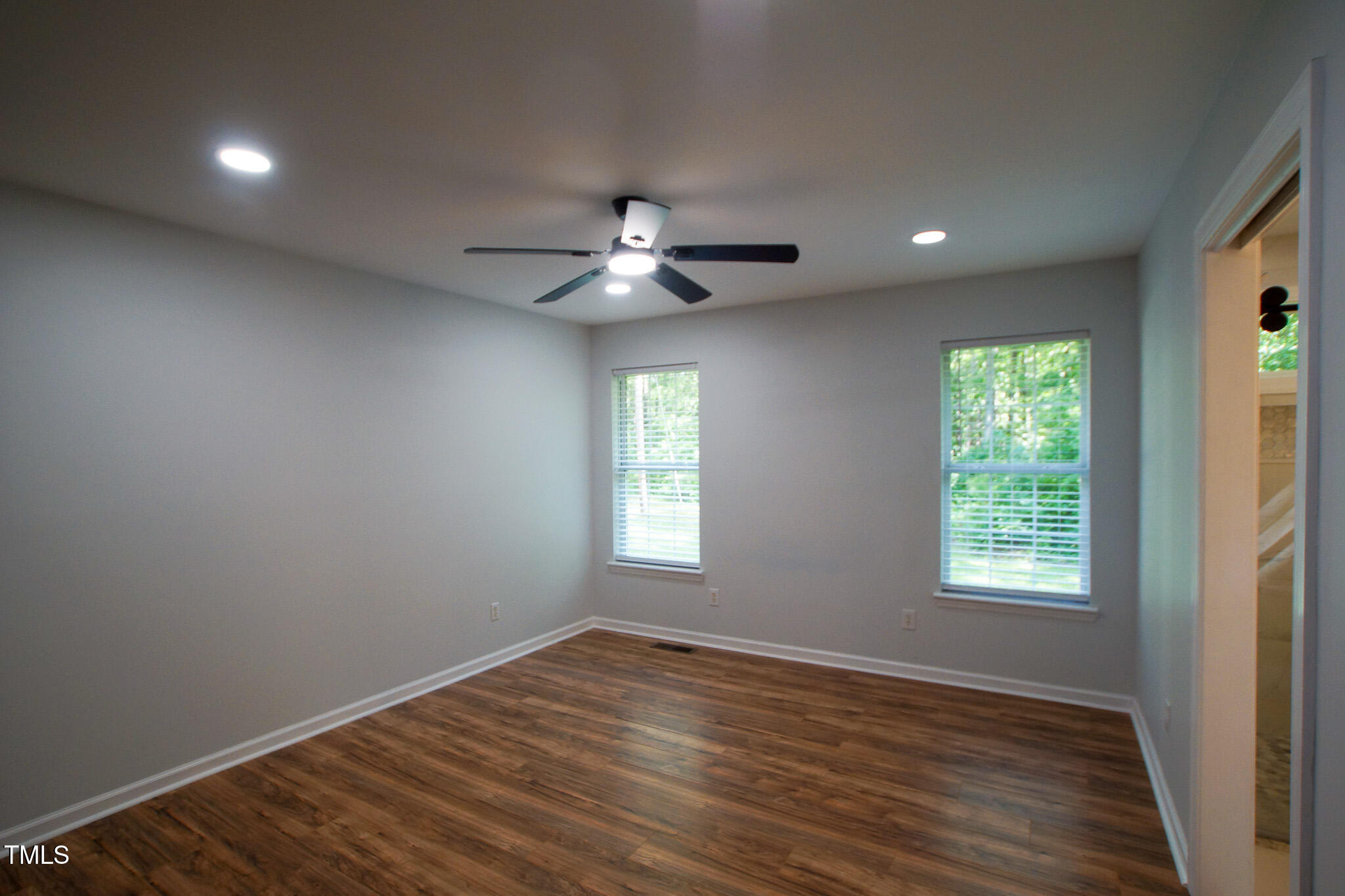 5705 Katha Drive Holly Springs, NC 27540 - Photo 25 of 27 wooden floor in an empty room with a window