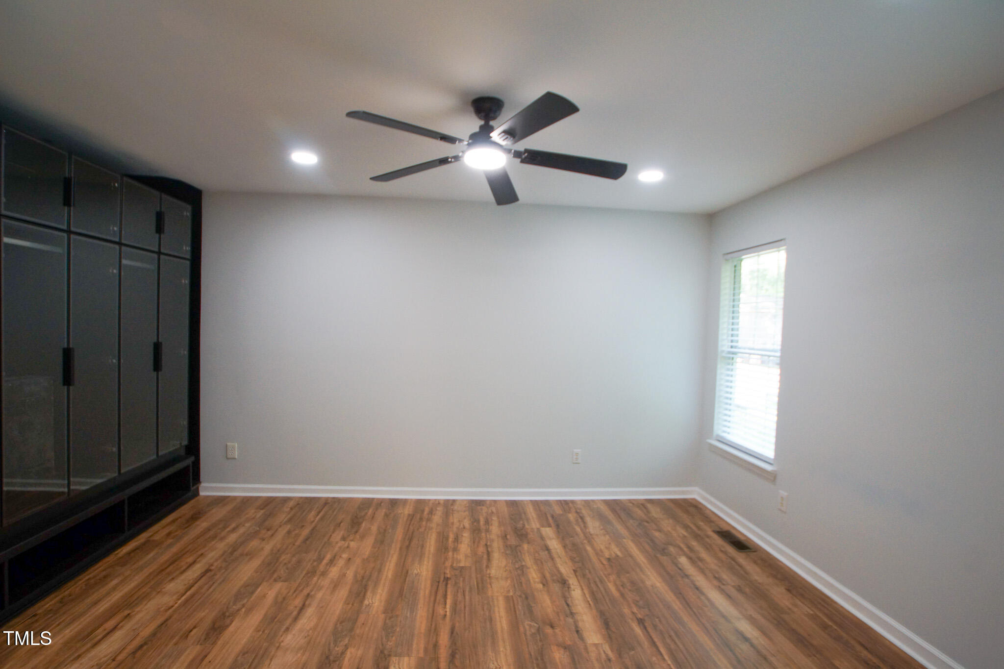 5705 Katha Drive Holly Springs, NC 27540 - Photo 26 of 27 wooden floor in an empty room with a window