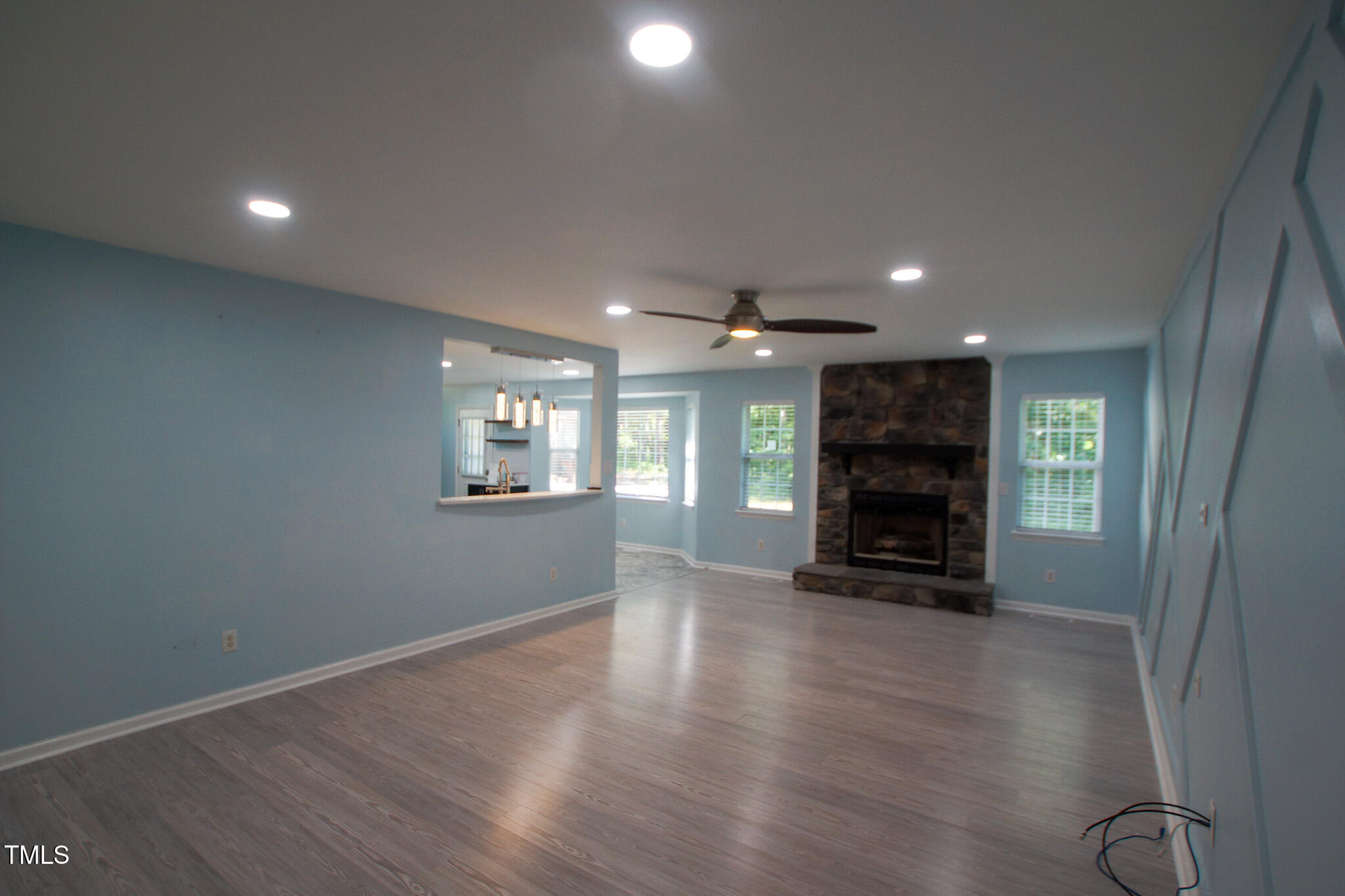 5705 Katha Drive Holly Springs, NC 27540 - Photo 5 of 27 an empty room with windows and a fireplace