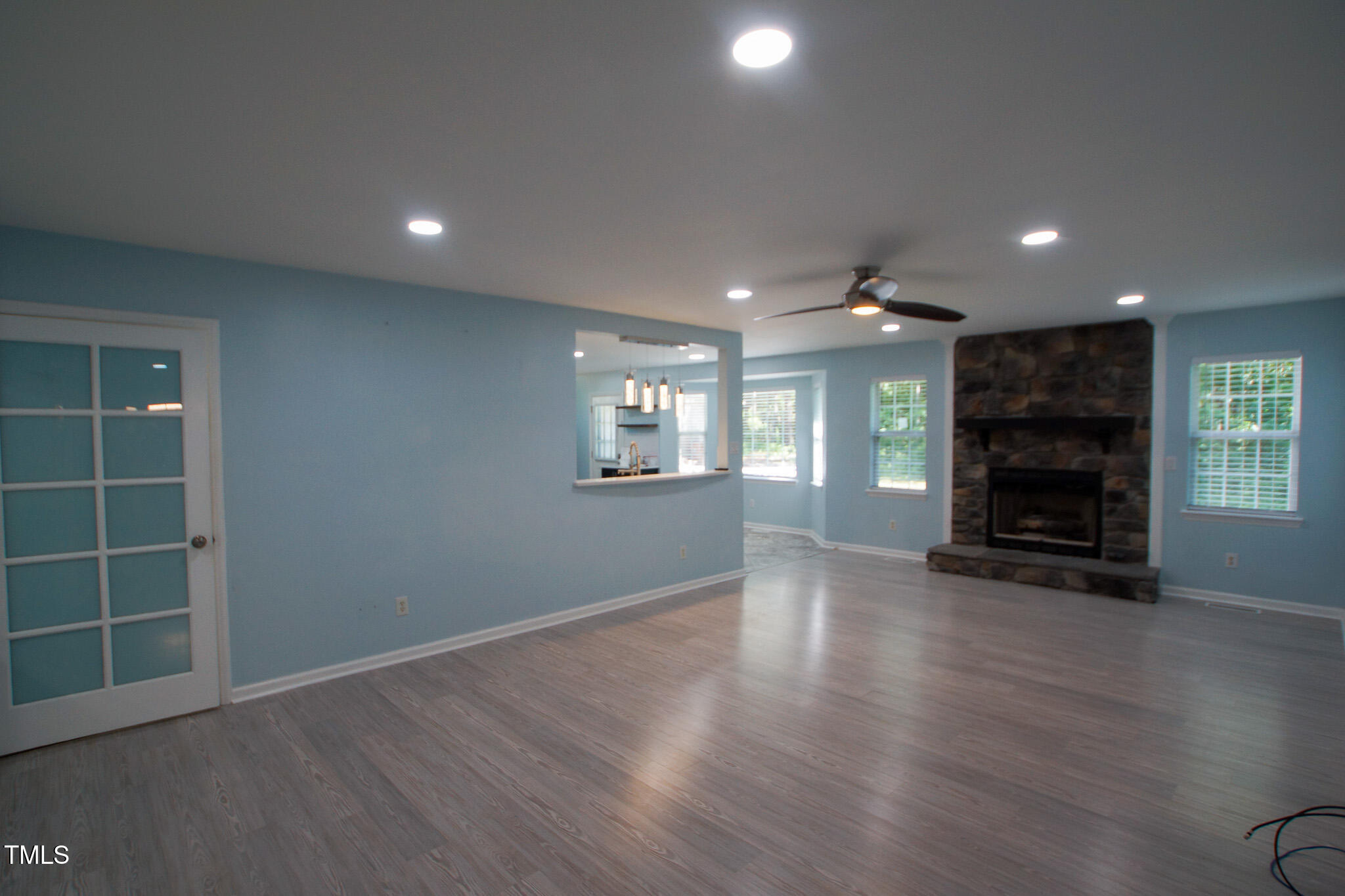 5705 Katha Drive Holly Springs, NC 27540 - Photo 6 of 27 an empty room with windows and fireplace