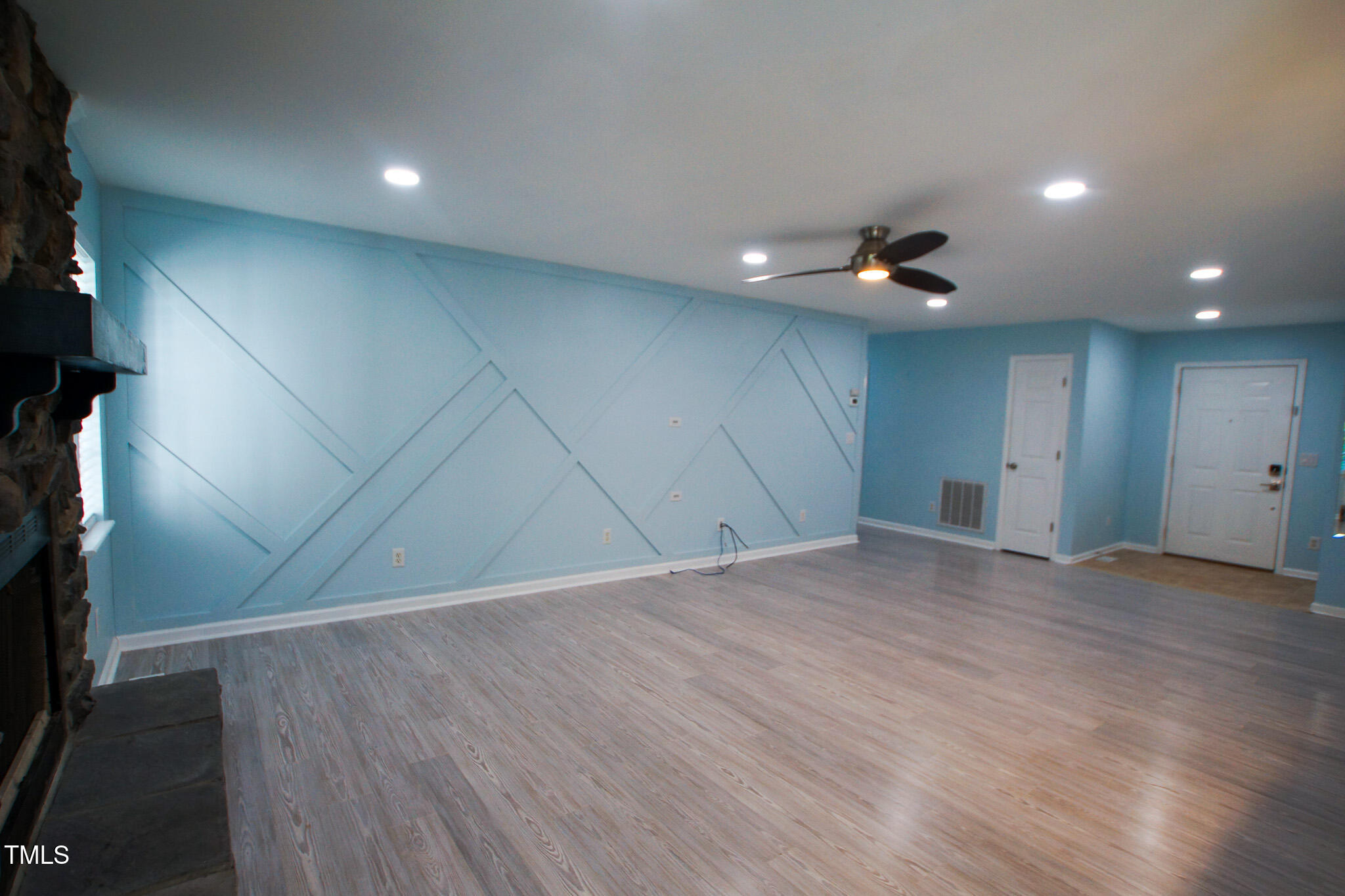 5705 Katha Drive Holly Springs, NC 27540 - Photo 9 of 27 a view of empty room with wooden floor
