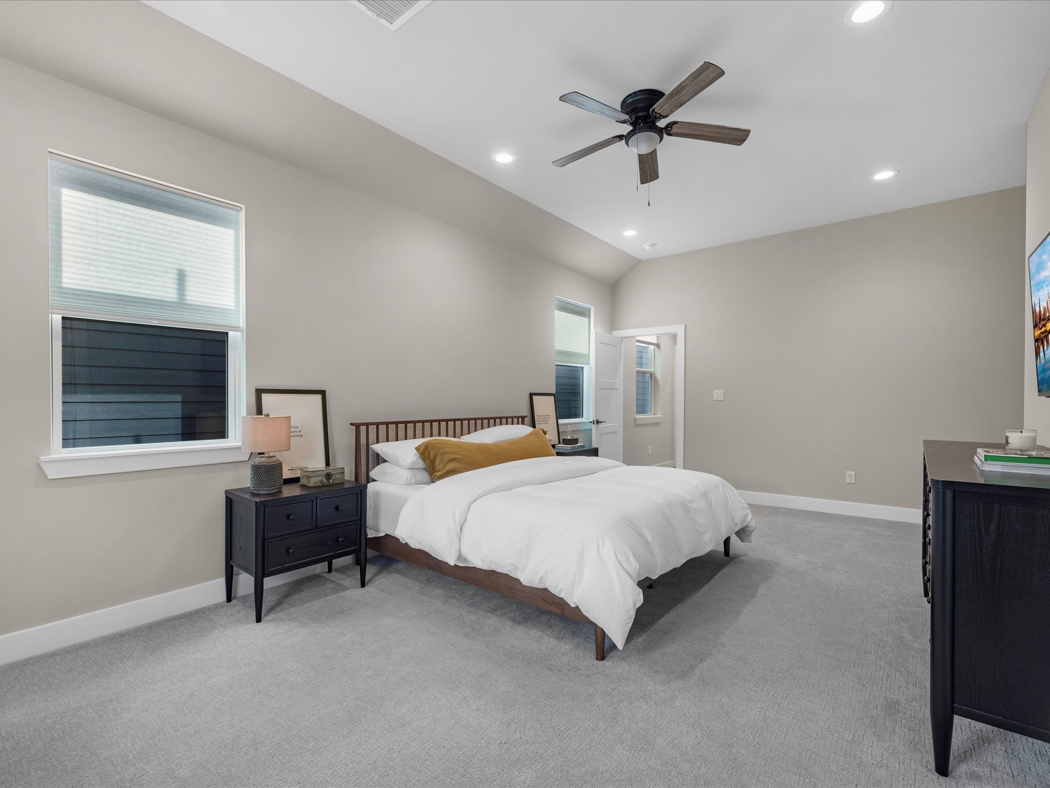 307 Charlock Street Houston, TX 77022 - Photo 13 of 17 Spacious upstairs bedroom featuring ample room and natural light.