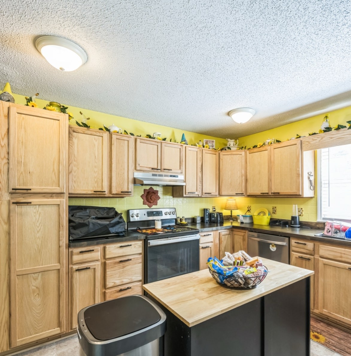 5312 West Trimble Road Milton, TN 37118 - Photo 21 of 42 a kitchen with a refrigerator a stove a sink dishwasher and a dining table with wooden floor