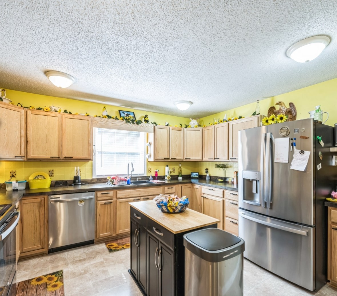 5312 West Trimble Road Milton, TN 37118 - Photo 22 of 42 a kitchen with stainless steel appliances granite countertop a sink stove and refrigerator