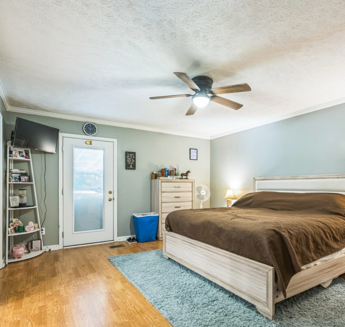 5312 West Trimble Road Milton, TN 37118 - Photo 33 of 42 a bedroom with a large bed and a chandelier