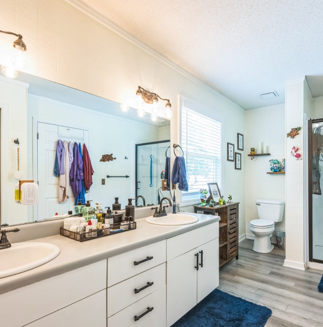 5312 West Trimble Road Milton, TN 37118 - Photo 36 of 42 a bathroom with a granite countertop sink mirror vanity and toilet