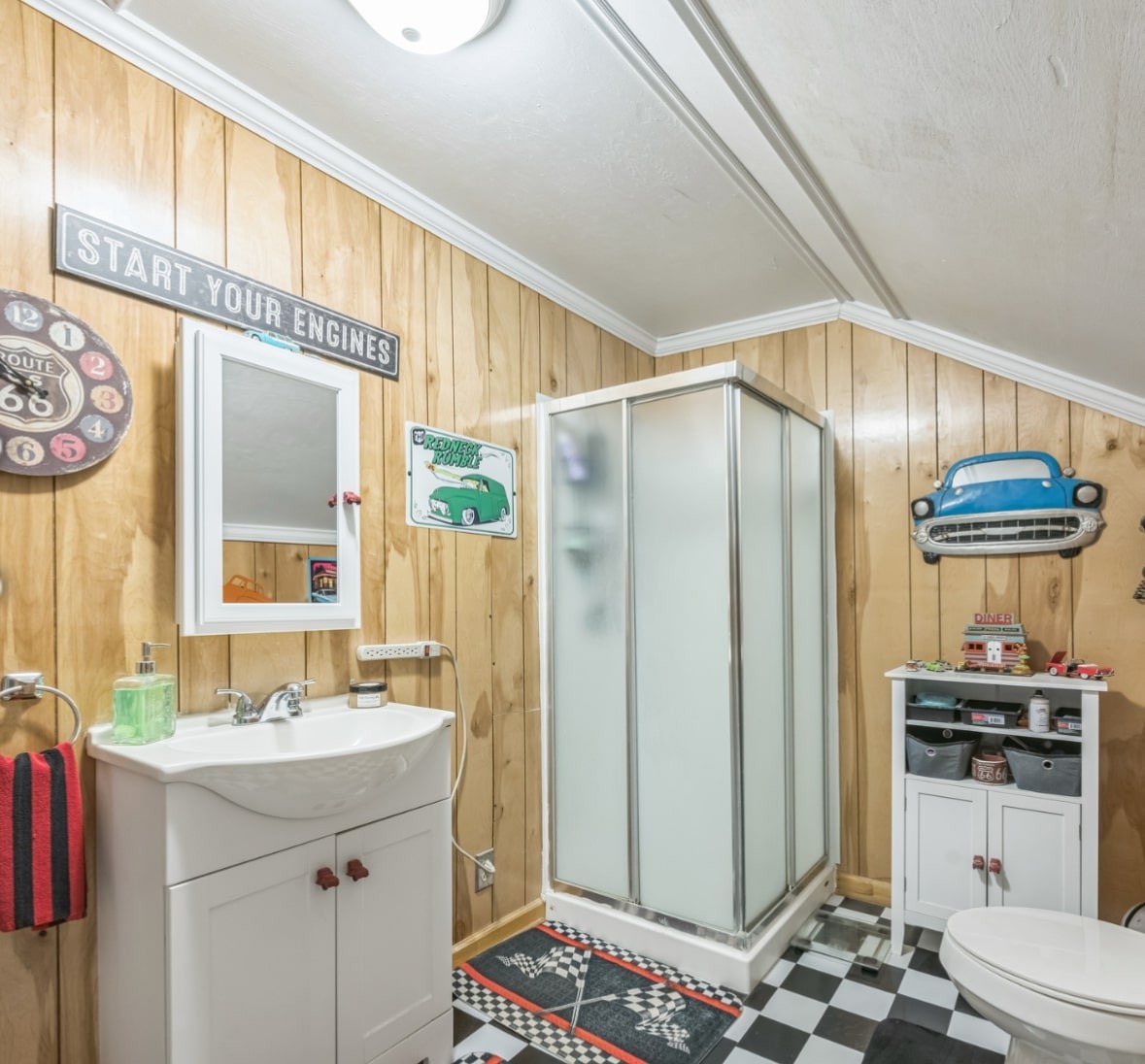 5312 West Trimble Road Milton, TN 37118 - Photo 37 of 42 a bathroom with a sink a mirror a toilet and a shower