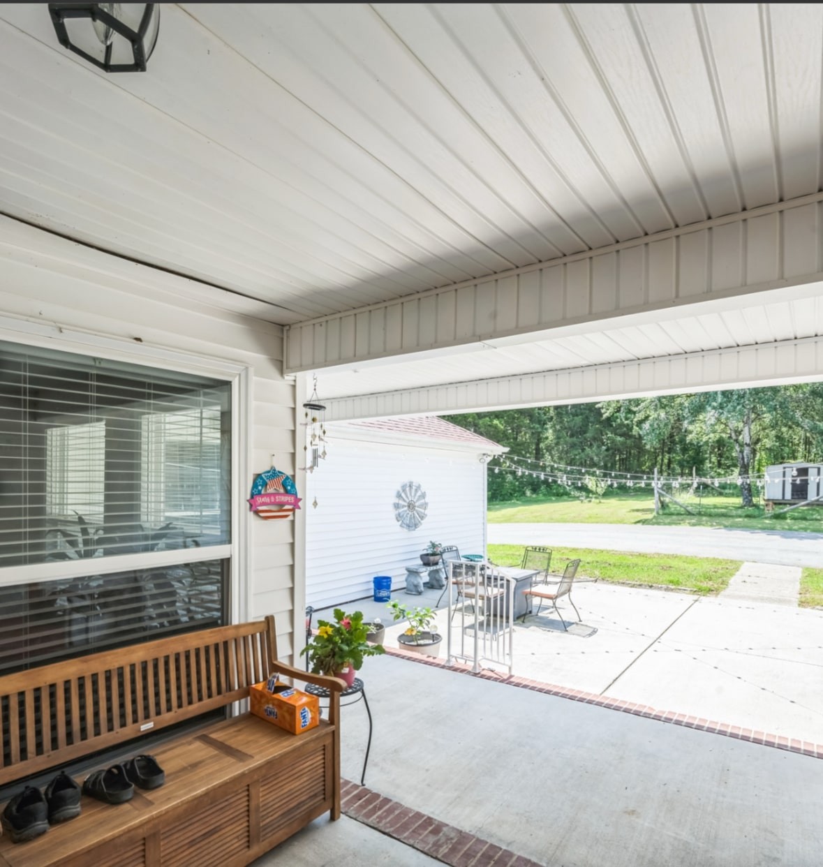 5312 West Trimble Road Milton, TN 37118 - Photo 9 of 42 a view of a patio with a table chairs and a swimming pool