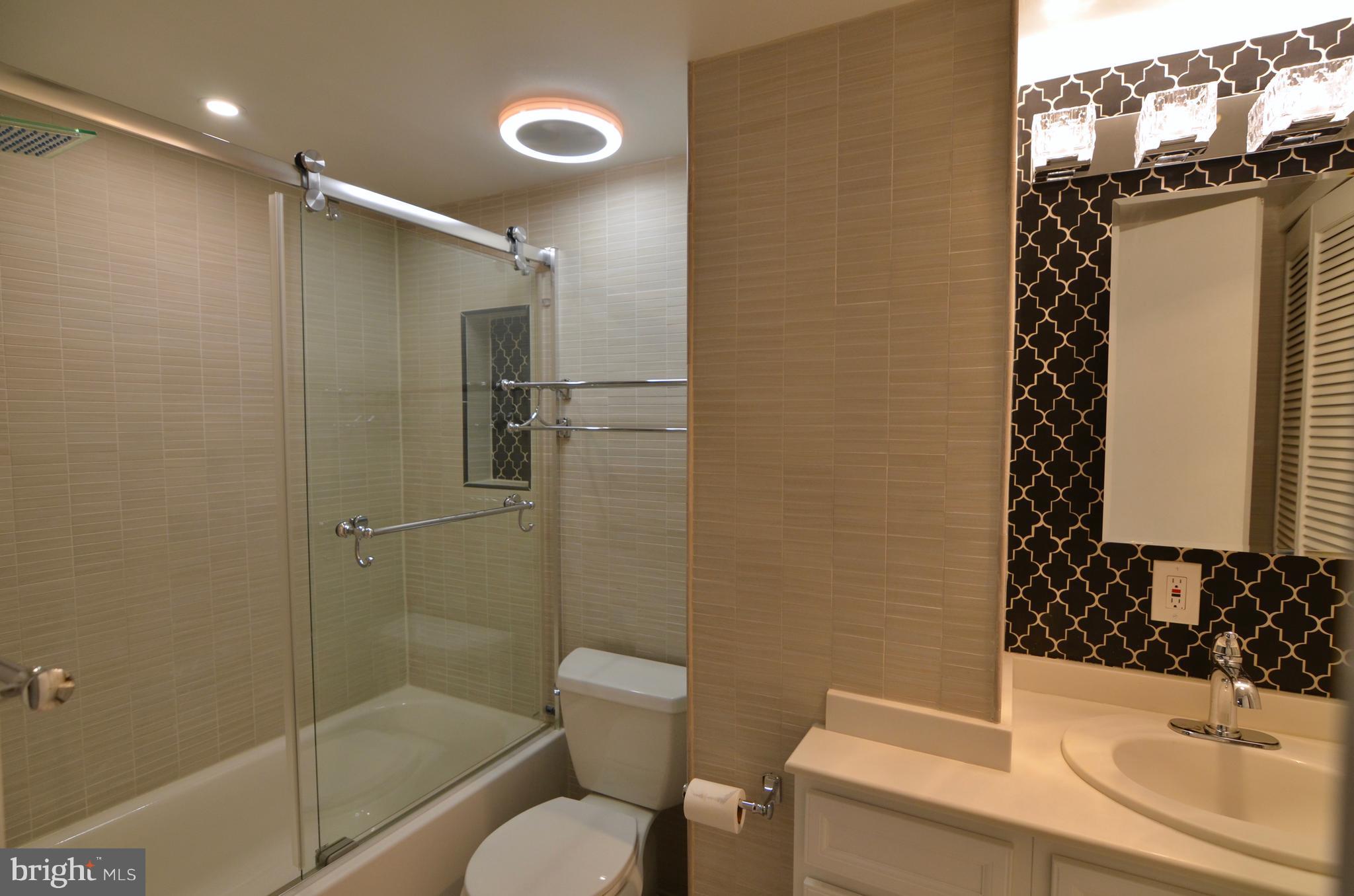 2114 N Street Northwest, Unit 2 Washington, DC 20037 - Photo 17 of 24 a bathroom with a sink toilet and shower