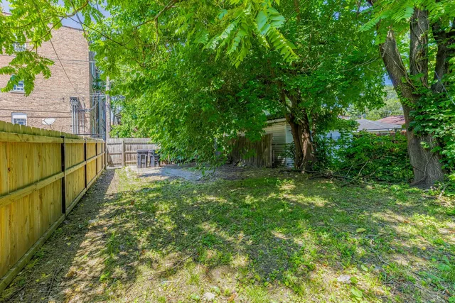 a aerial view of a house with balcony and trees