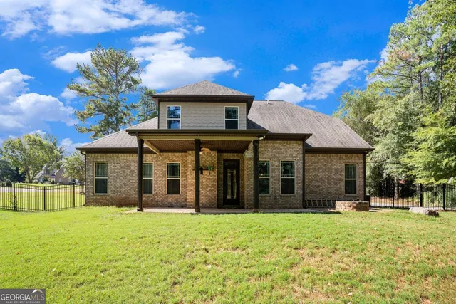 a view of a swimming pool with a yard
