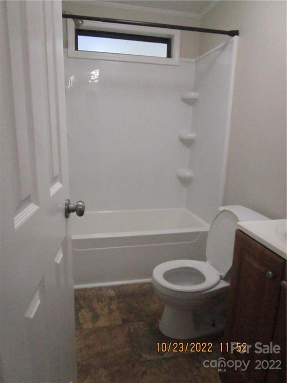 2605 Hinson Road, Unit P1 Monroe, NC 28112 - Photo 17 of 18 a bathroom with a toilet and a shower