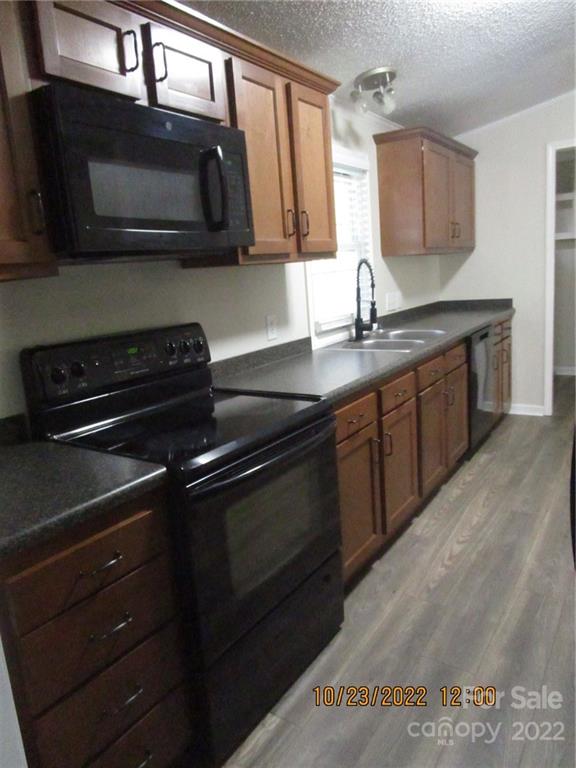 2605 Hinson Road, Unit P1 Monroe, NC 28112 - Photo 7 of 18 a kitchen with a sink stove and microwave