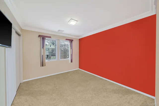 a bed room with a bed and a dresser