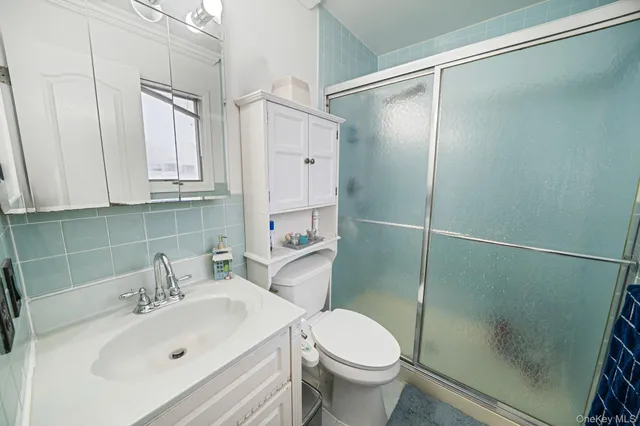 a bedroom with bed and window