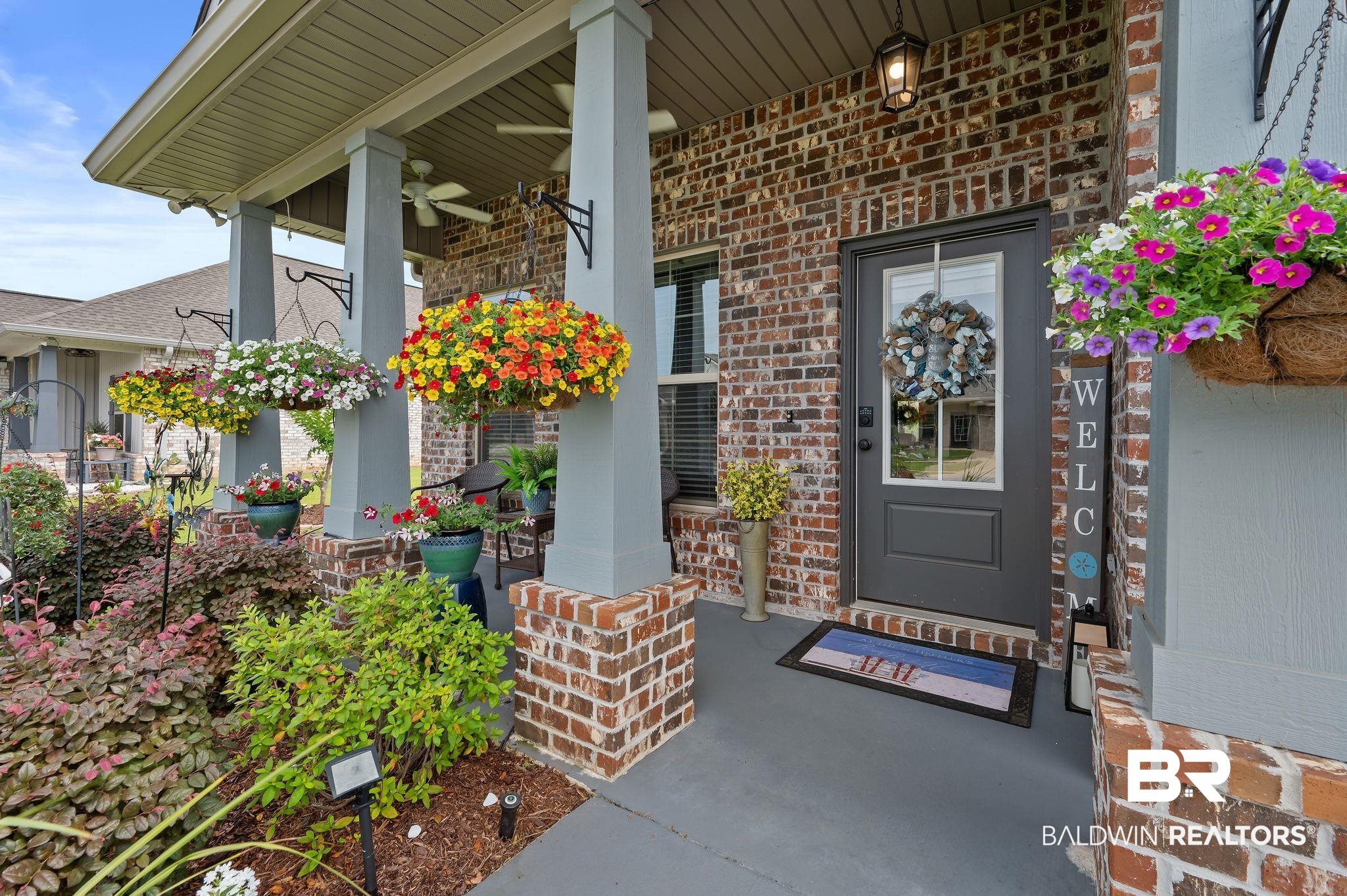 1165 Stella Road Foley, AL 36535 - Photo 3 of 42 Property entrance with a porch, brick siding, and a ceiling fan