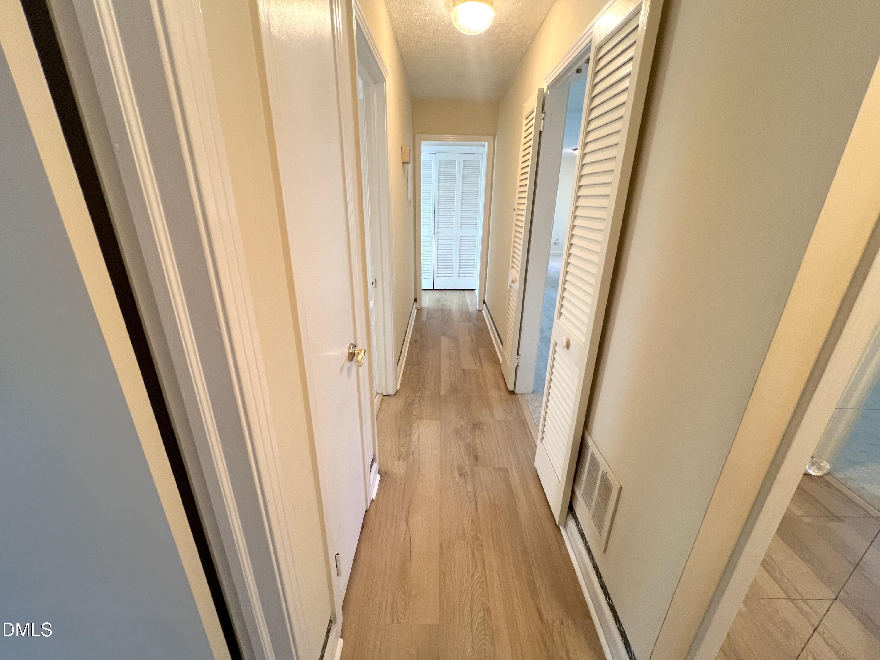 66 Allensville Road Roxboro, NC 27573 - Photo 21 of 52 a view of a hallway with wooden floor and stairs