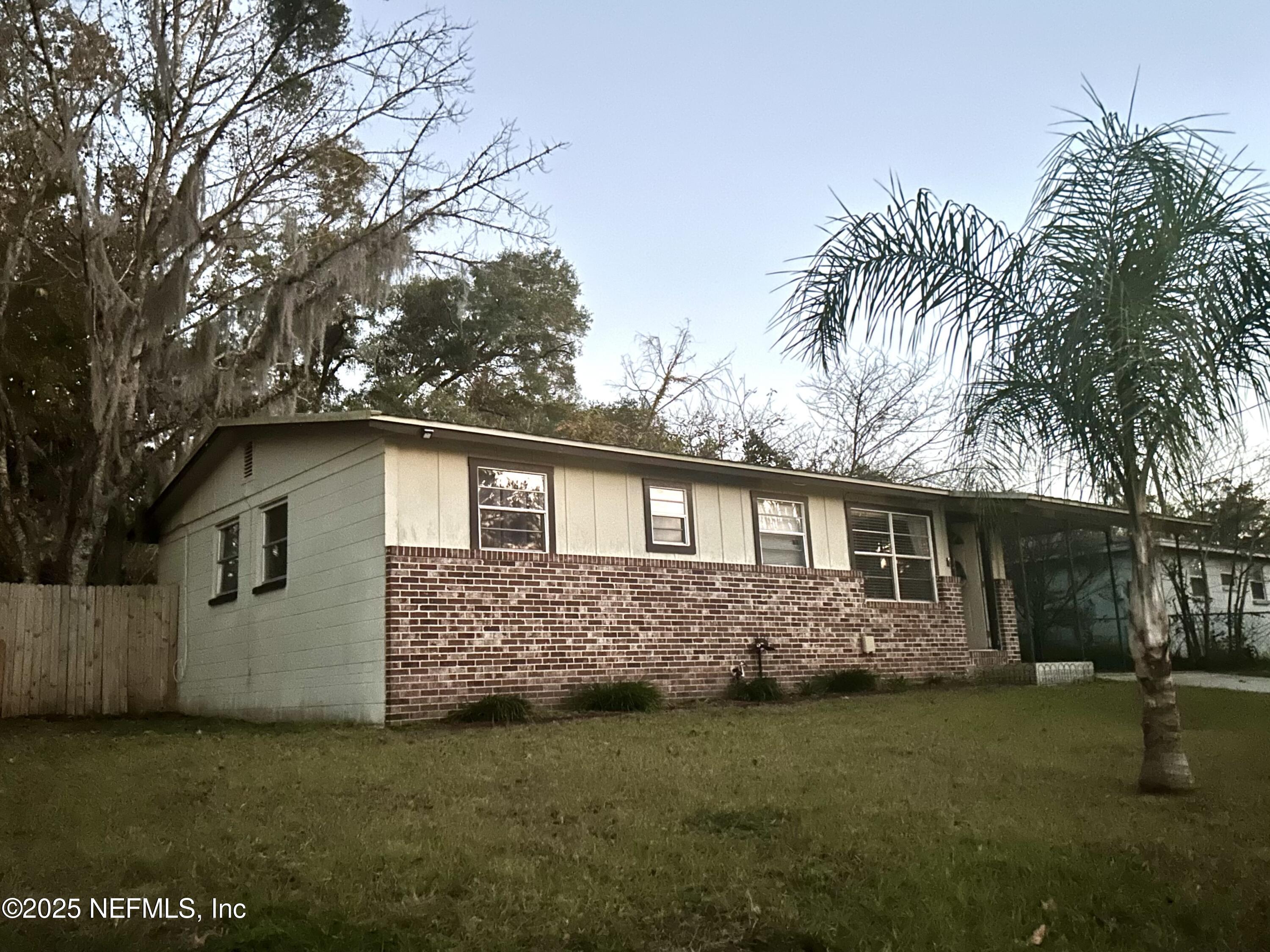 258 Capella Road Orange Park, FL 32073 - Photo 1 of 15 a front view of a house with a garden