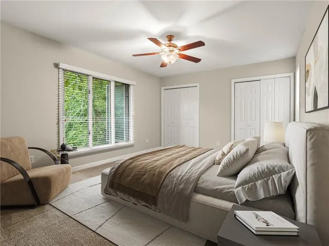 a bedroom with a bed and a couch