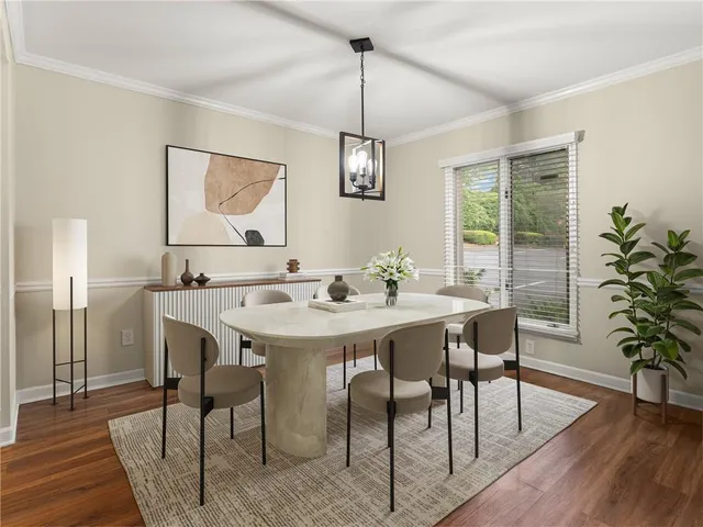 a view of a dining room with furniture window and wooden floor