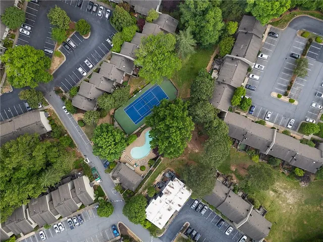 an aerial view of a house with a yard