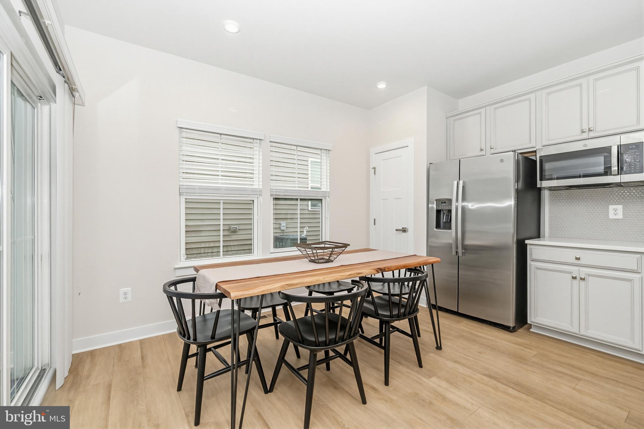 1326 Stonefly Lane Odenton, MD 21113 - Photo 15 of 48 a view of a dining room with furniture and stainless steel appliances