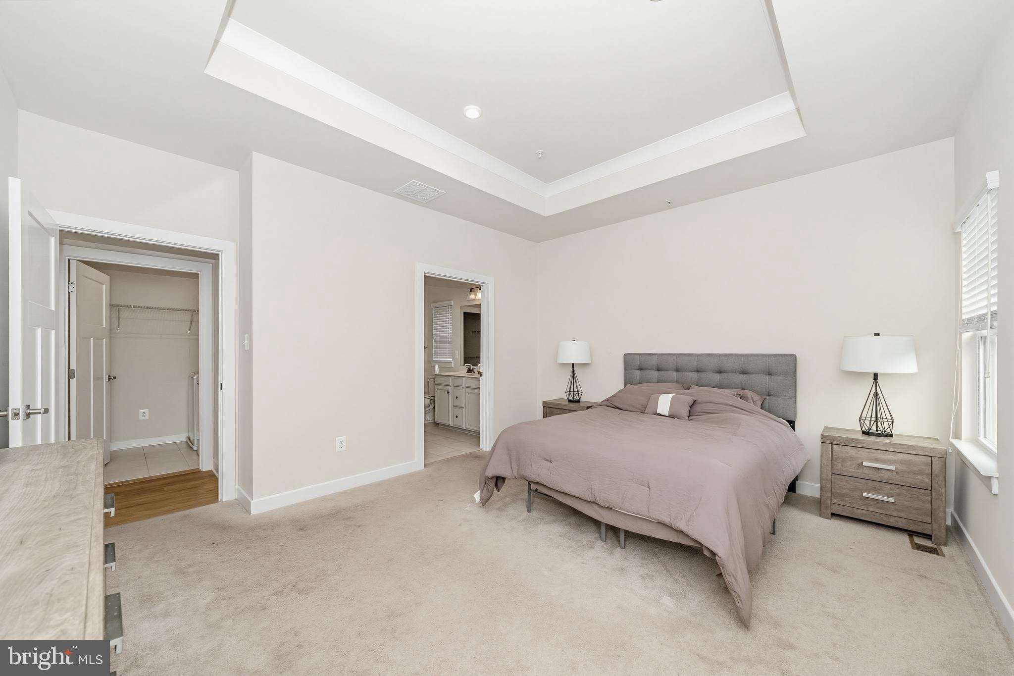 1326 Stonefly Lane Odenton, MD 21113 - Photo 19 of 48 a bedroom with a bed and a lamp