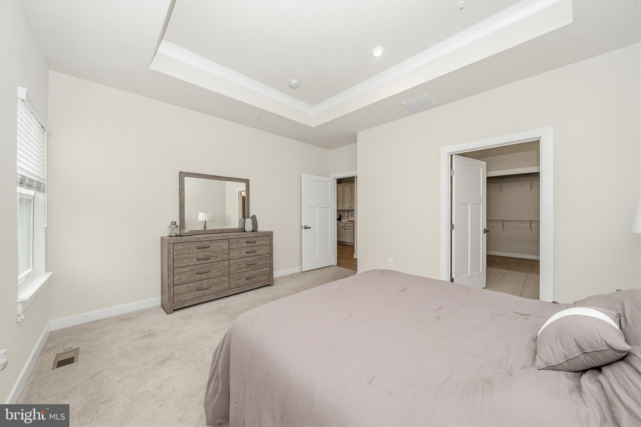 1326 Stonefly Lane Odenton, MD 21113 - Photo 22 of 48 a bedroom with a large bed and dresser