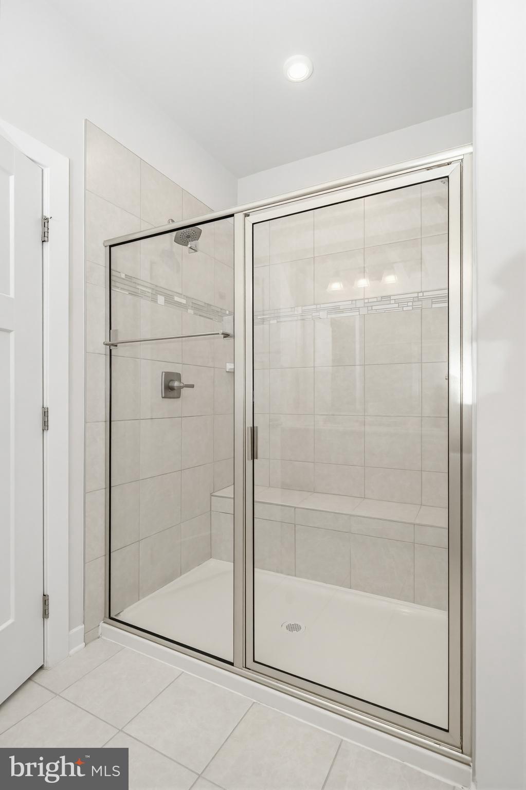 1326 Stonefly Lane Odenton, MD 21113 - Photo 24 of 48 a bathroom with a glass shower door