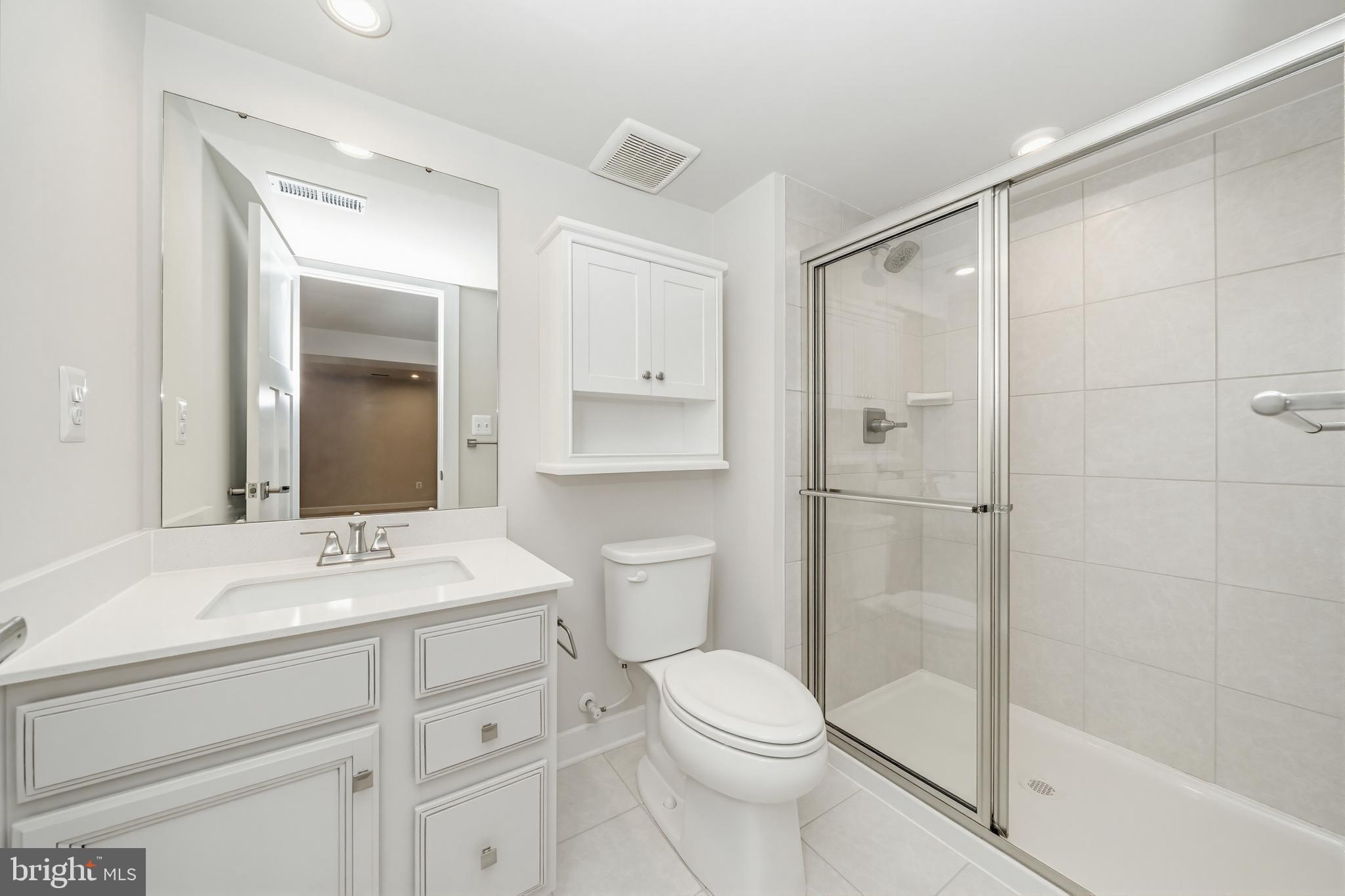 1326 Stonefly Lane Odenton, MD 21113 - Photo 26 of 48 a bathroom with a sink a toilet and shower