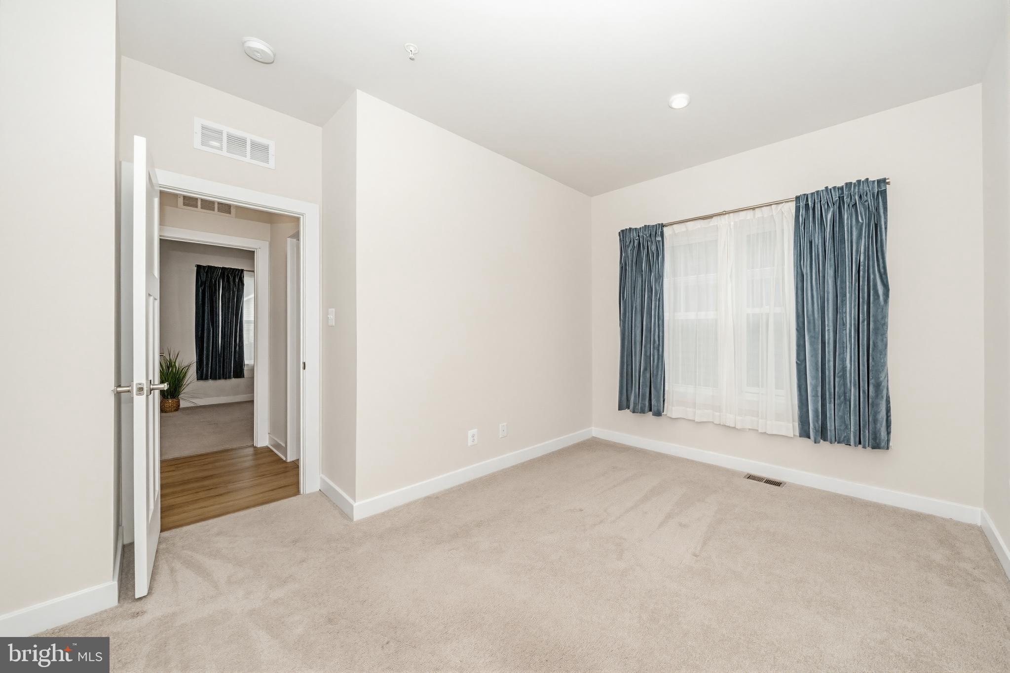 1326 Stonefly Lane Odenton, MD 21113 - Photo 27 of 48 a view of an empty room with glass door