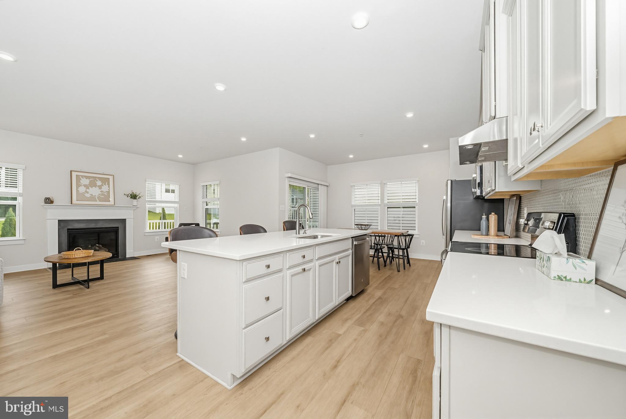 1326 Stonefly Lane Odenton, MD 21113 - Photo 6 of 48 a large kitchen with a table and chairs