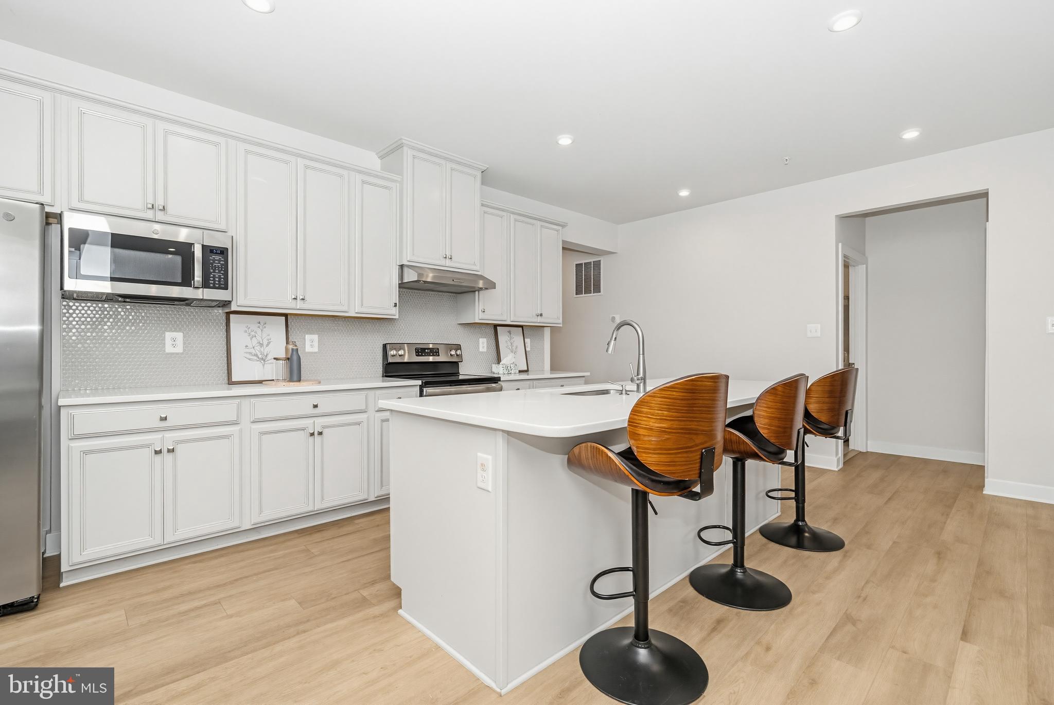 1326 Stonefly Lane Odenton, MD 21113 - Photo 9 of 48 a kitchen with a sink cabinets and appliances